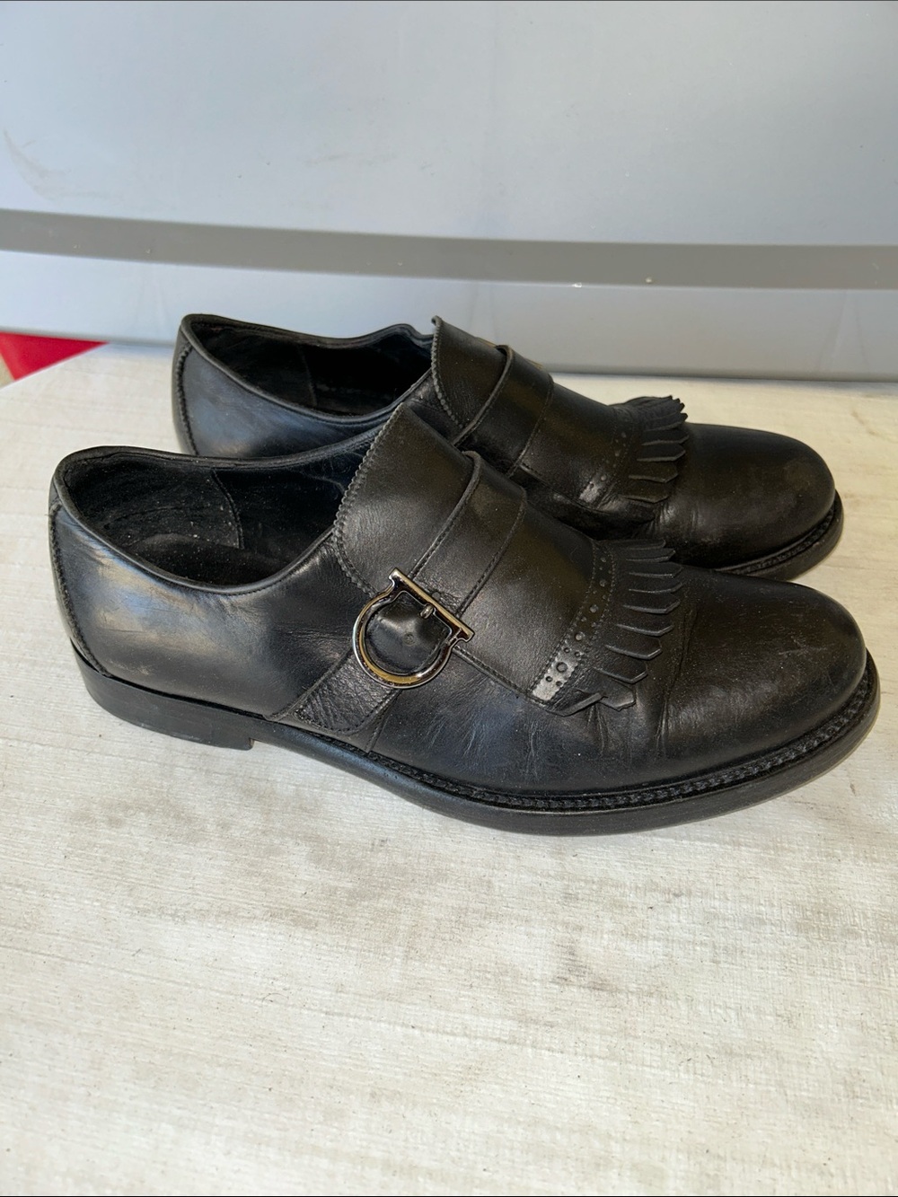 Salvatore Ferragamo Black Leather Kiltie Loafers with Buckle Accent